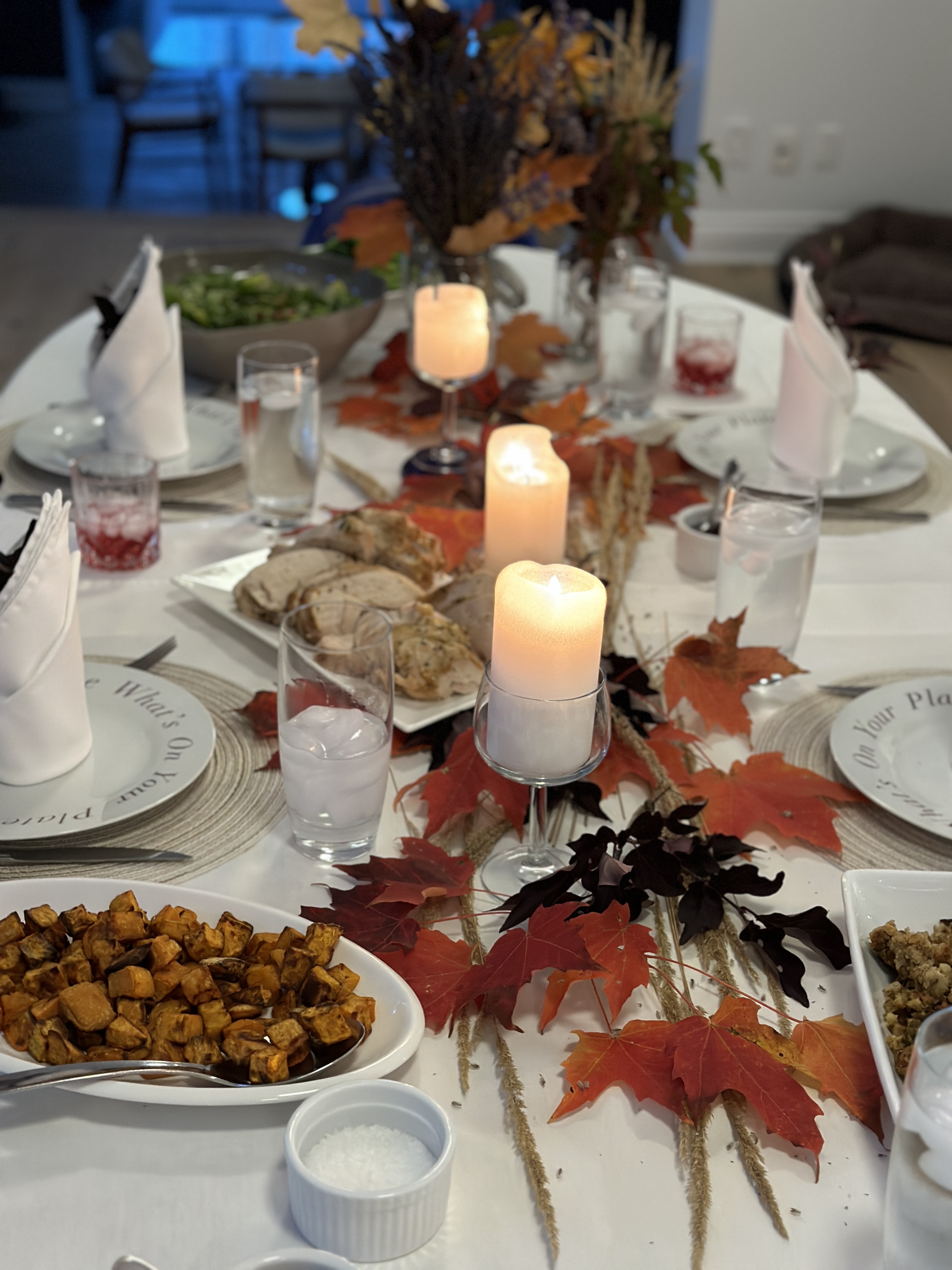A buffet Stephanie hosted: smoked salmon platters, a big green salad, croissants and candles